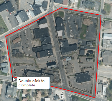 The Polygon drawing tool for Spatial Search sets a red polygon as you click on the map. A red line connects the first point you drew to the most recent one you drew. A callout that says “Double-click to complete” follows your cursor.